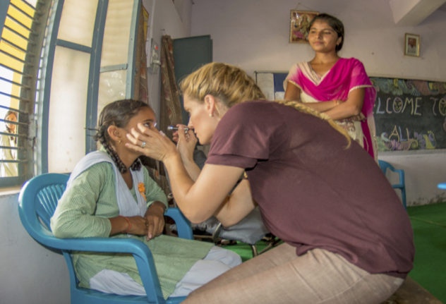 optometrist giving eye exam
